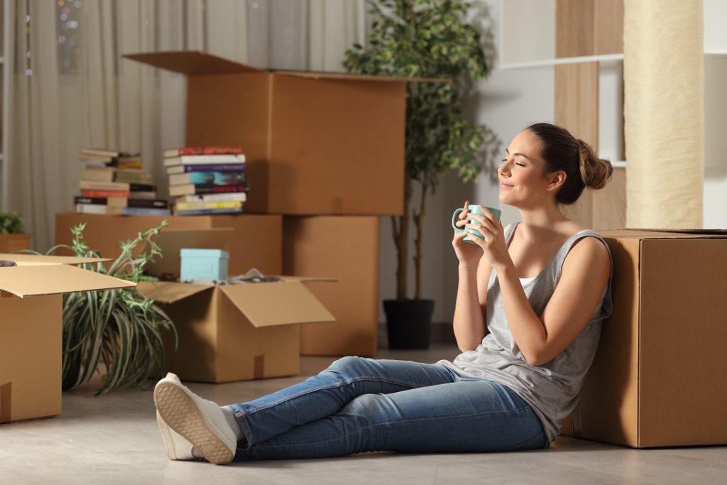 Happy tenant moving home resting breathing fresh air Happy tenant moving home resting breathing fresh air